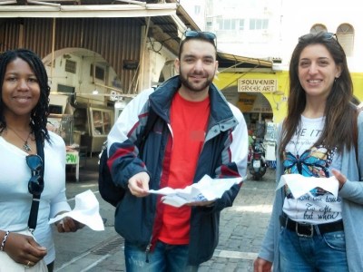 a woman standing next to a building