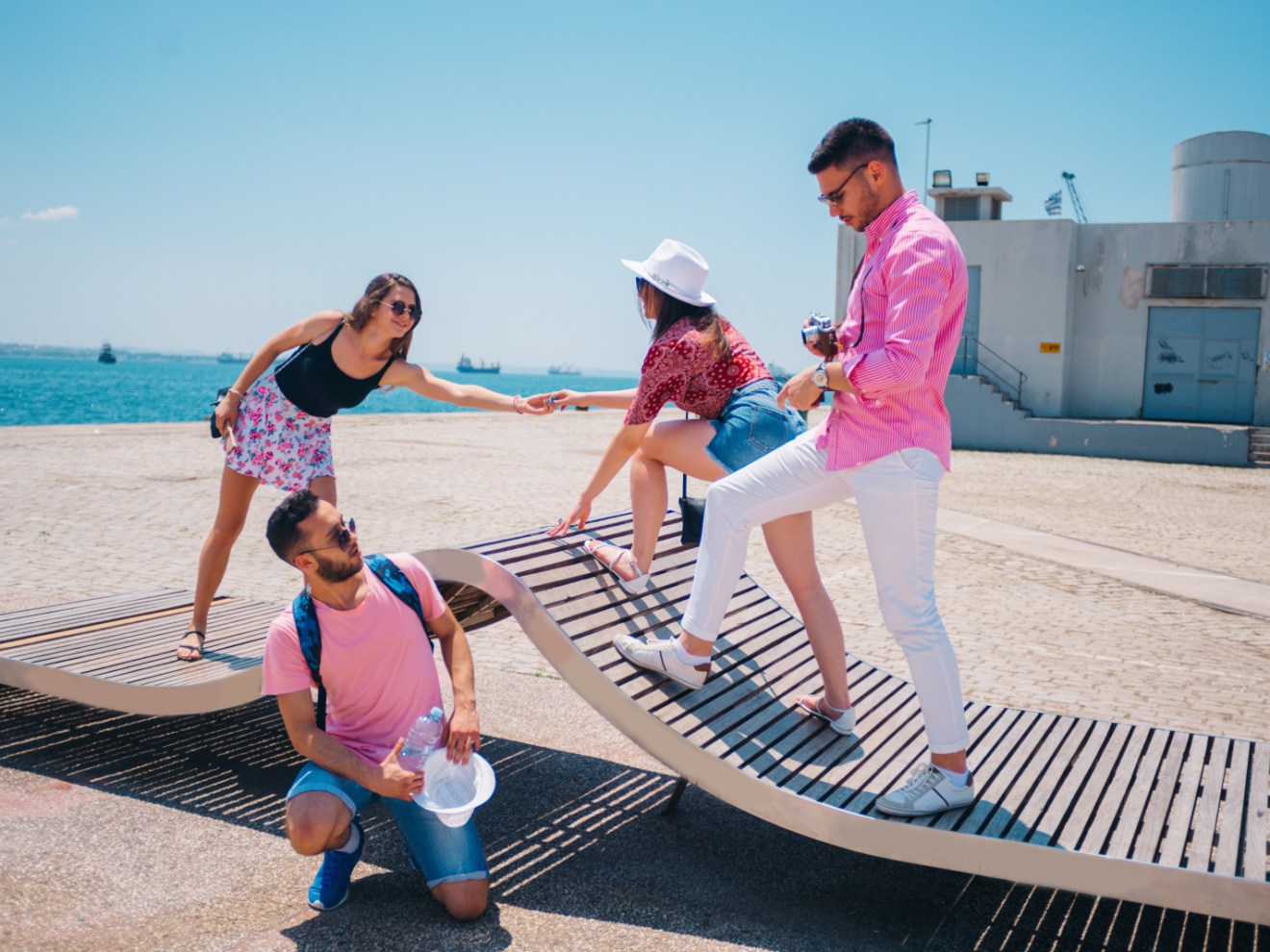 a group of people sitting at a beach