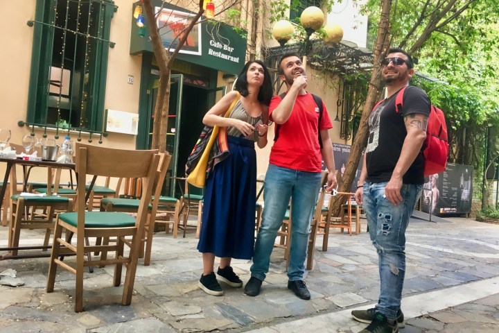 a person standing on a sidewalk